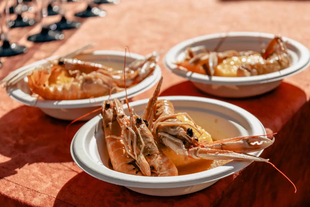 Chefs prepare dishes of fish, squid and seafood during the Novljanski gušti event.